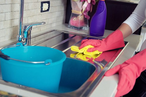 Staff member assessing workplace hazards before cleaning